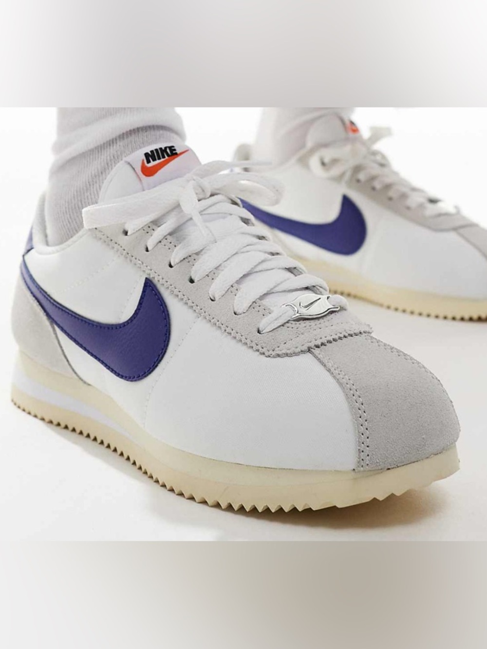 Nike White Cortez Sneakers with Purple Swoosh